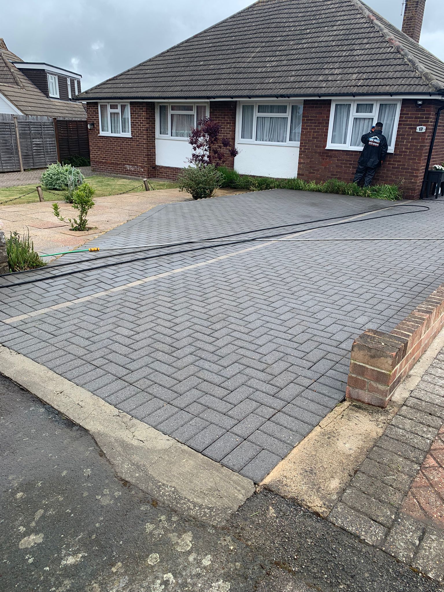 Block paving bungalow driveway fully restored after professional pressure washing in Kent