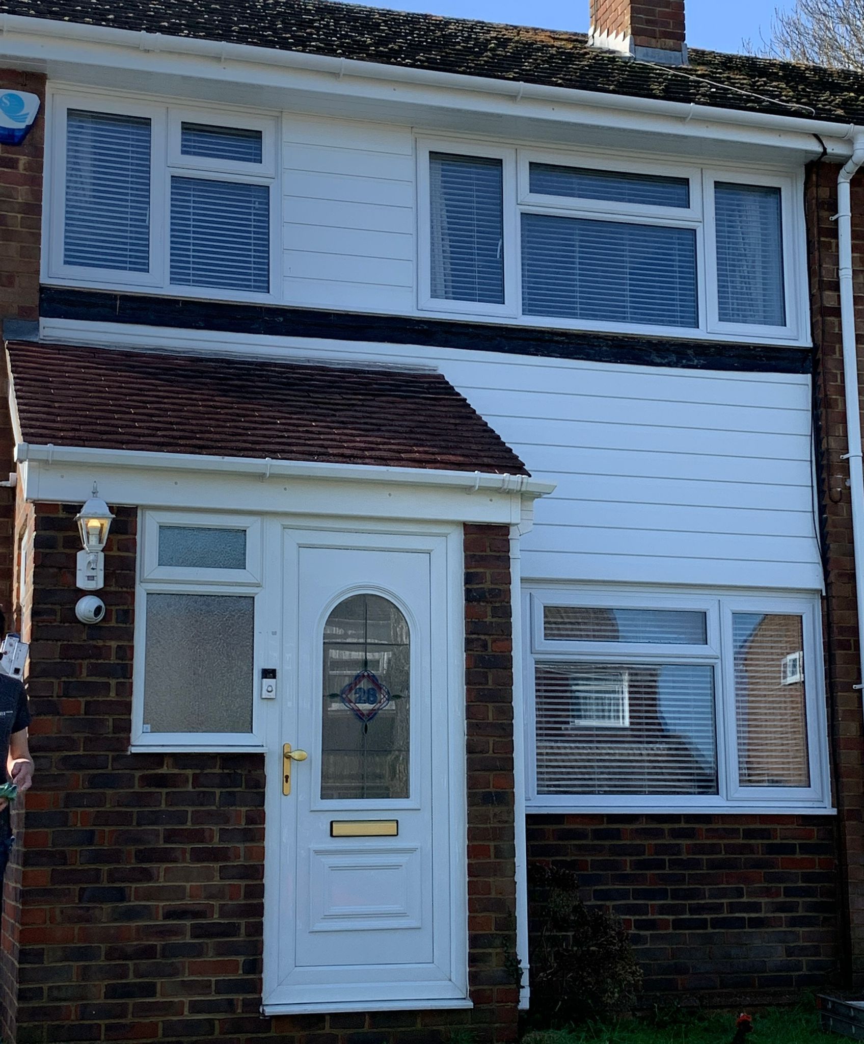 Clean terrace house exterior after roof moss removal and soft wash treatment in Kent