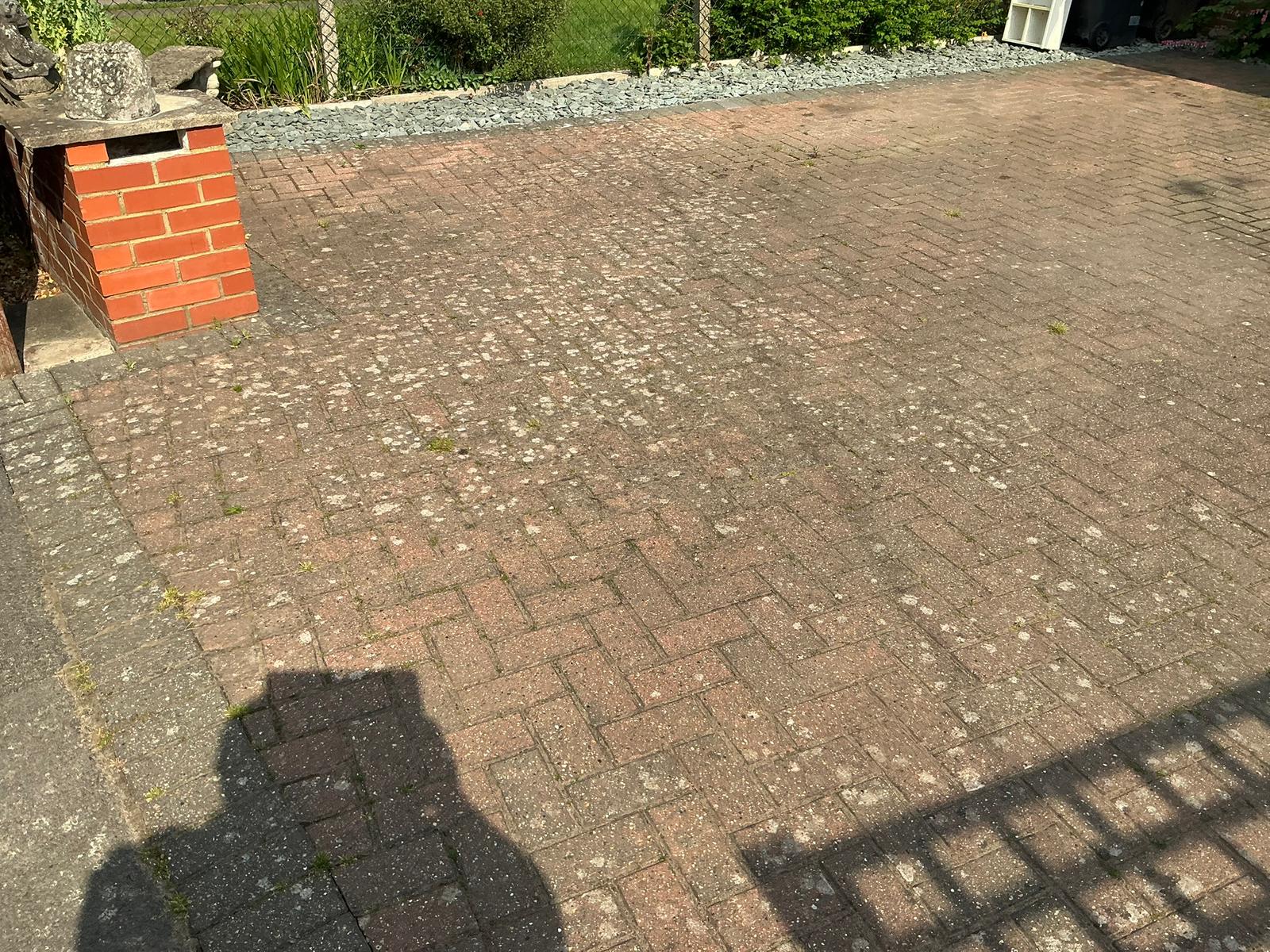Red herringbone block paving driveway faded and weathered before pressure washing in Kent